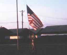 Camp USARTHAI Days End and folding our flag - SP/4 Holliday